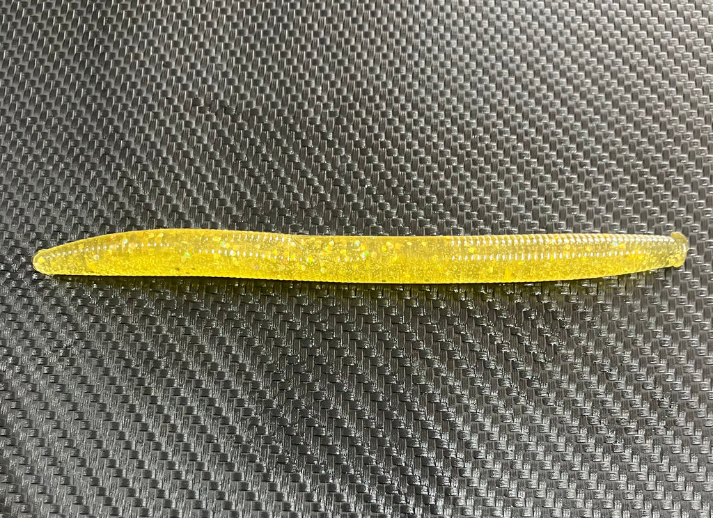 Yellow tool on a textured gray surface