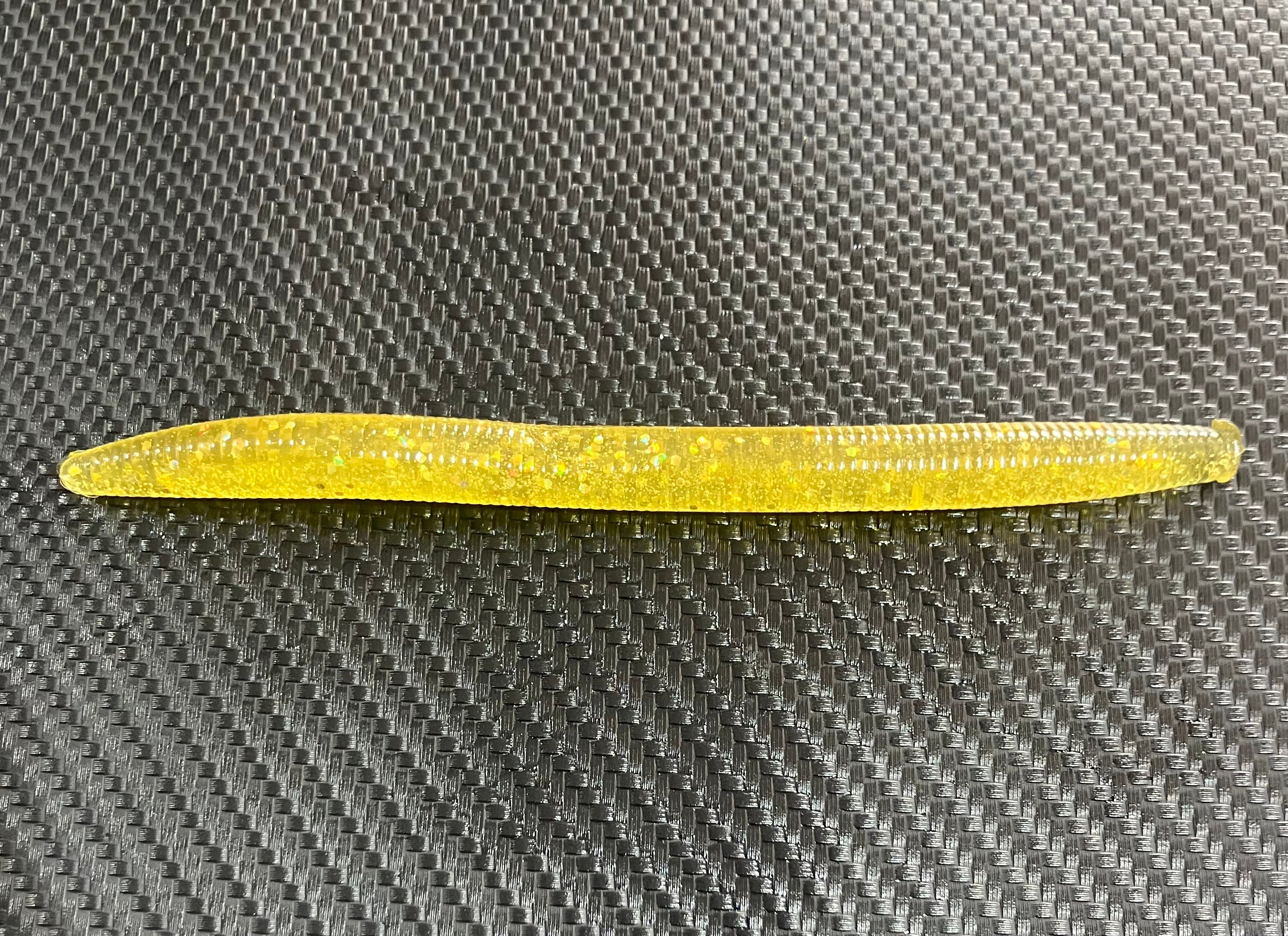 Yellow tool on a textured gray surface